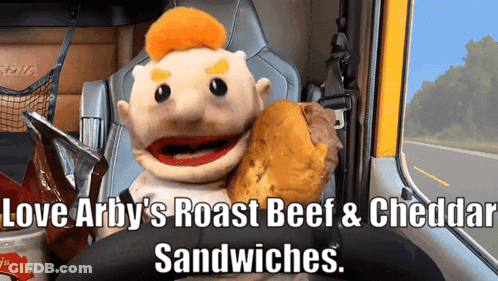 Puppet Holding Roast Beef And Cheddar Sandwich In Truck GIF