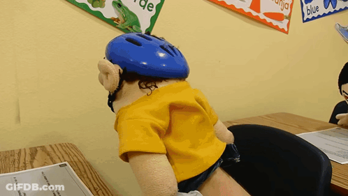 Puppet In Helmet At Desk GIF