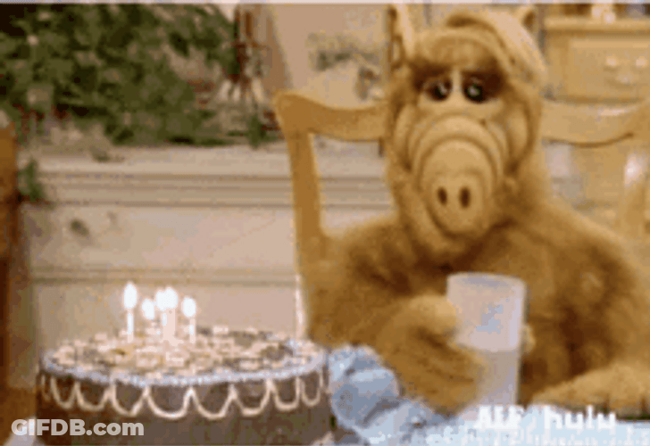 Puppet Pouring Water On Birthday Candles GIF