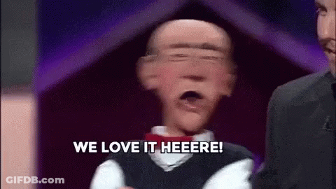 Puppet Saying We Love It Heere In Front Of Man In Suit GIF