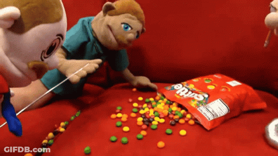 Puppet Smocking On Skittles Candy GIF
