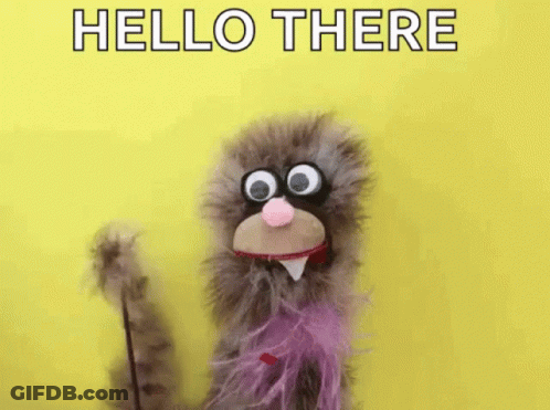 Puppet With Big Eyes And Pink Bow Tie Waving Hello There GIF