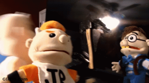 Puppet With TP Shirt Next To Another Puppet GIF