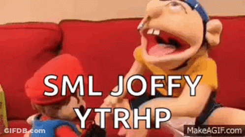 Puppets Sitting On Red Couch GIF