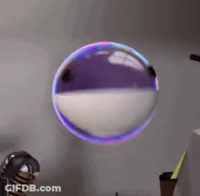 Purple And White Soap Bubble Floating On Wall GIF