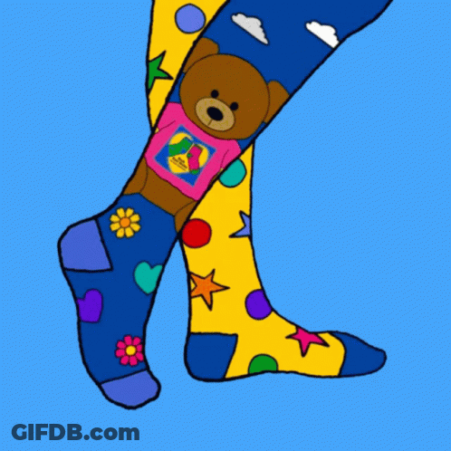 Purple And White Socks With Flowers And Polka Dots GIF
