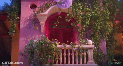 Purple Building With Balcony And Flowers GIF