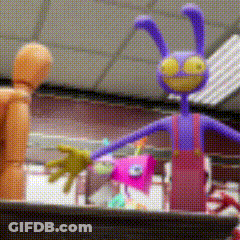 Purple Bunny Toy Next To Wooden Mannequin GIF