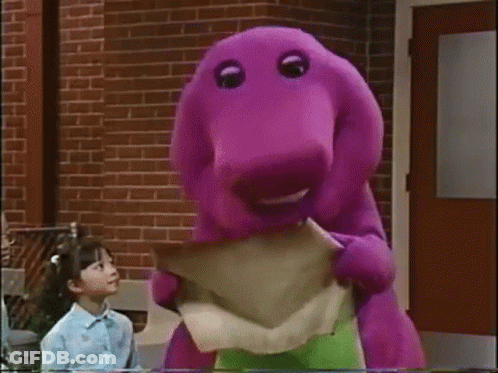 Purple Dinosaur Holding Paper By Brick Building GIF