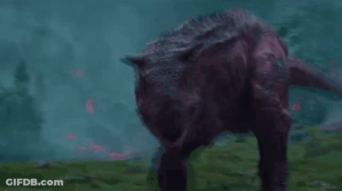 Purple Dinosaur With Mouth Open In Grass GIF
