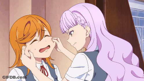 Purple Haired Girl Touching Orange Haired Girl's Face GIF
