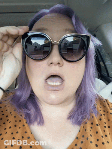 Purple-Haired Woman In Sunglasses With Open Mouth GIF