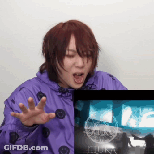 Purple Jacket Woman Funny Face Beside Screen Saying Jihura GIF
