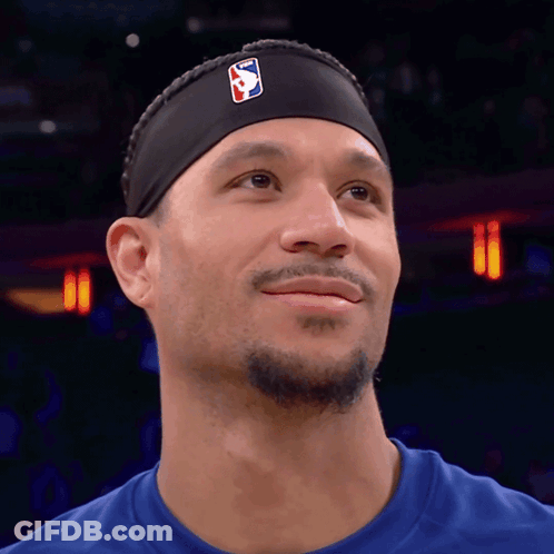 Purple Lakers Player Holding Candy Canes At Christmas Tree GIF
