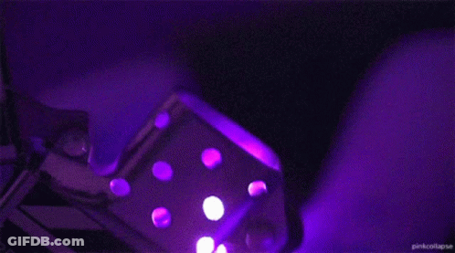 Purple Lighter With Sparks In Dark GIF