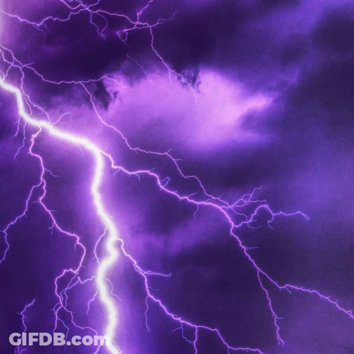 Purple Lightning Strikes In Night Sky GIF