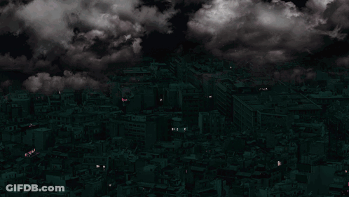 Purple Lightning Strikes Over A City With A Cloudy Sky GIF