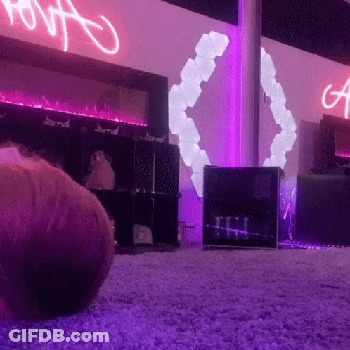 Purple Lit Room With A Sign GIF