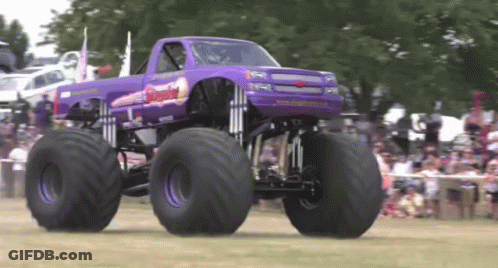 Purple Monster Truck Driving In Front Of Crowd GIF