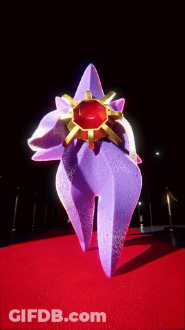 Purple Object With Red Center On Red Surface GIF