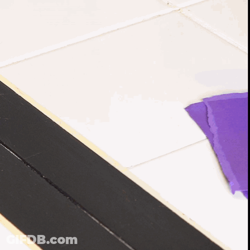 Purple Paper On Tiled Floor GIF
