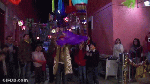 Purple Piñata Thrown By Group GIF