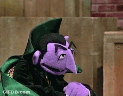 Purple Puppet In Green Cape With Purple Nose And Mustache GIF
