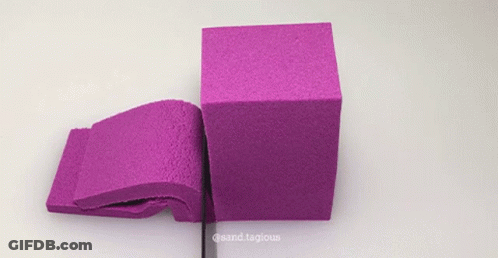 Purple Sand Cube Cut In Half By Ruler GIF