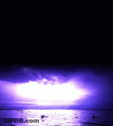 Purple Sky Over Water With Boats GIF