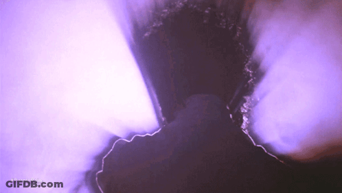 Purple Smoke Is Coming Out Of A Hole In A Wall GIF