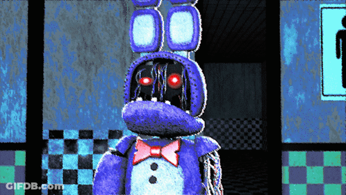 Purple Stuffed Animal With Red Eyes Standing In Room GIF