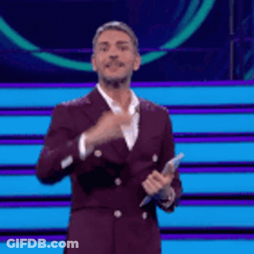 Purple Suit Man Holding Microphone And Thumbs Up GIF