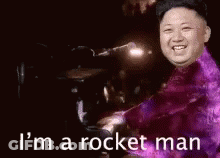 Purple Suit Man Playing Piano Saying I'm A Rocket Man GIF