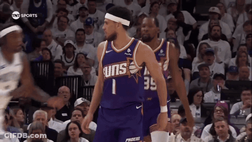 Purple Suns Basketball Player With Crowd GIF