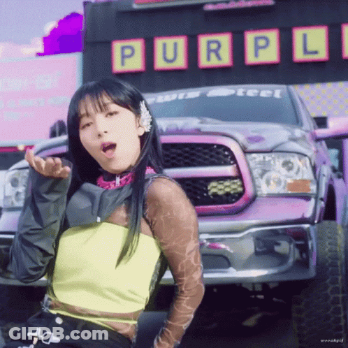 Purple Truck Parked In Front Of Purple Sign GIF