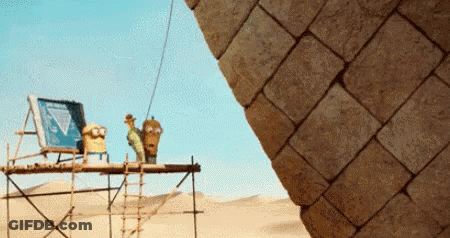 Pyramid Being Built In Desert With Ladder GIF