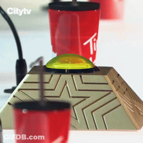 Pyramid With Yellow Button And Cup Letter T GIF