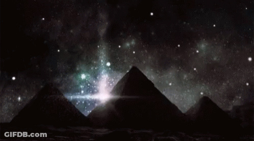 Pyramids Under Starry Night Sky GIF