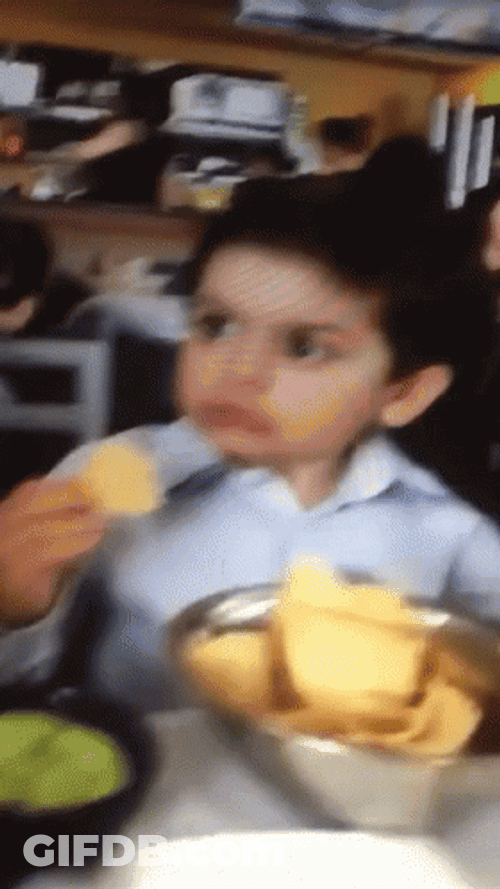 Que Confused Eating Child GIF