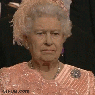 Queen Elizabeth II In Pink Dress And Feathered Hat GIF