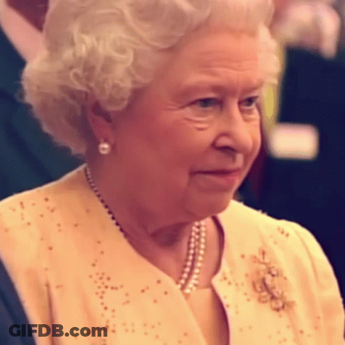 Queen Elizabeth Ii Is Wearing A Yellow Jacket And Pearls GIF