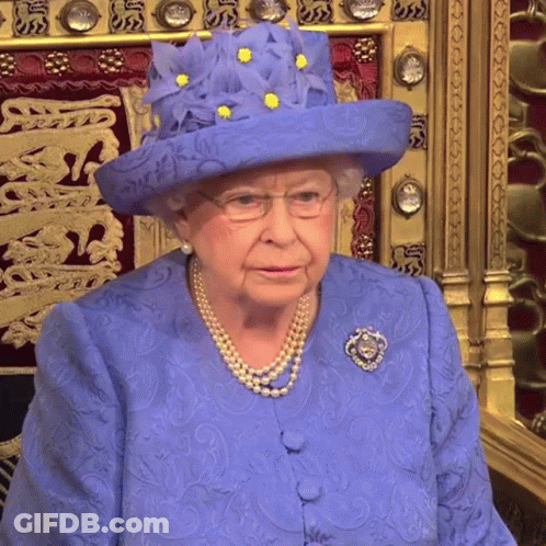 Queen Elizabeth Wearing A Blue Hat With Yellow Flowers On It GIF