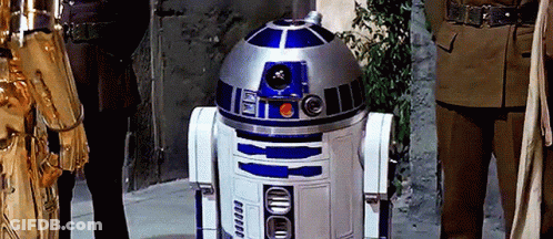 R2D2 Robot Next To Man Statue GIF