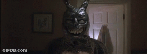 Rabbit Mask Person In Dark Room GIF