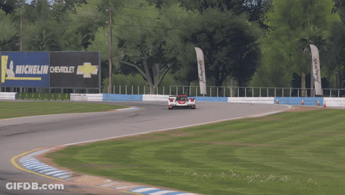 Race Car Around Curve With Michelin Sign GIF