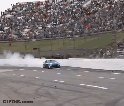 Race Car Drifting On Track With Crowd GIF