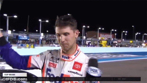 Race Car Driver In FedEx Jersey Holding Up Hand GIF