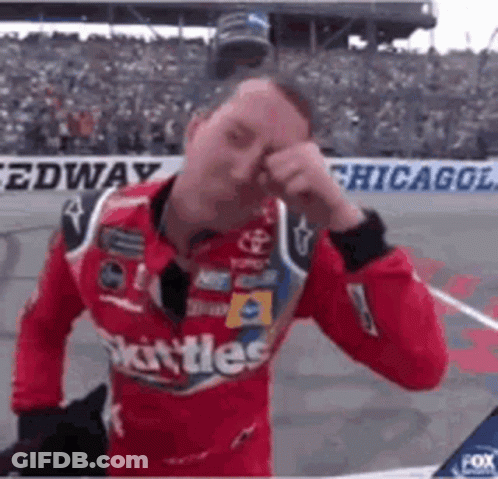 Race Car Driver Rubbing Face GIF
