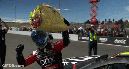Race Car Driver Taco Over Head Coca Cola Banner GIF