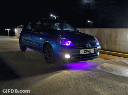 Race Car Driving By Planet Air Building GIF